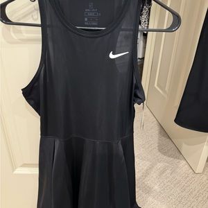 Black Nike tennis dress size small. Never worn.